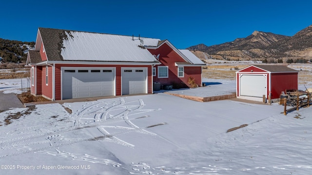 view of front of house featuring a mountain view and a garage