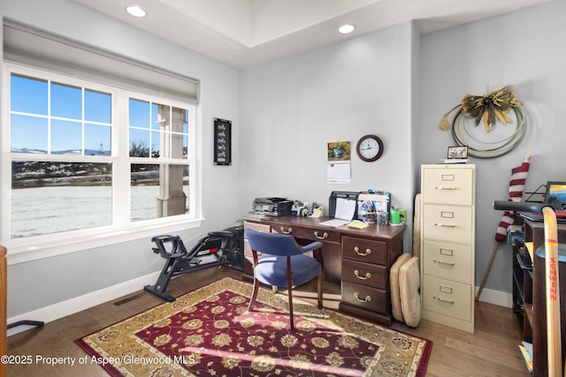 office space with dark wood-type flooring