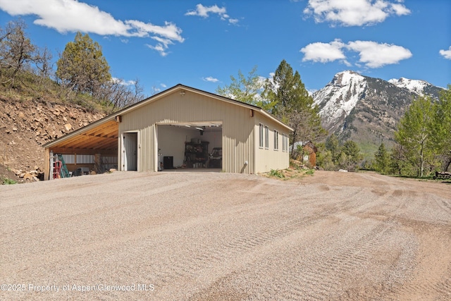 108 Prospector Trl, Marble, CO 81623 - garage with a detached garage, a mountain view, and driveway