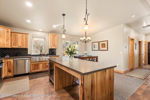 3900 County Road 3, Marble, CO 81623 - kitchen featuring sink, dishwasher, hanging light fixtures, a center island, and decorative backsplash