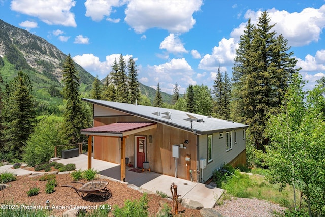 3900 County Road 3, Marble, CO 81623 - view of front of house with a garage and a mountain view