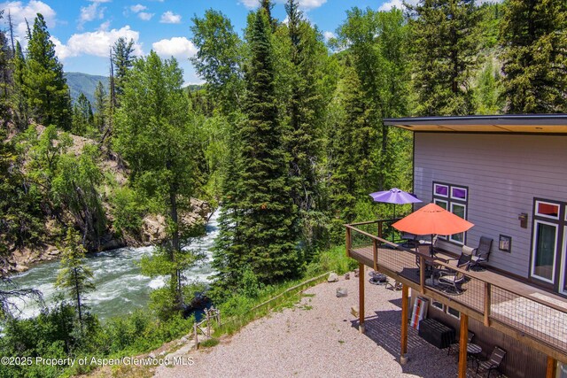 3900 County Road 3, Marble, CO 81623 - view of patio / terrace with a deck with water view