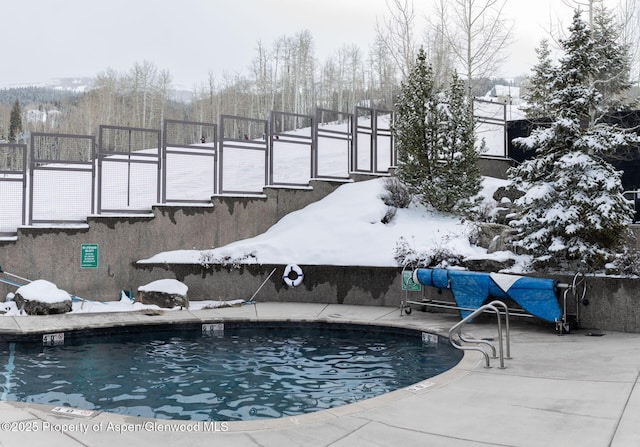 view of snow covered pool