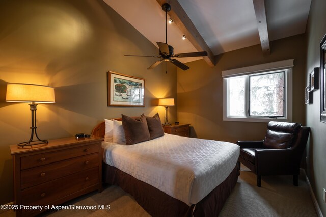 bedroom featuring vaulted ceiling with beams and carpet floors