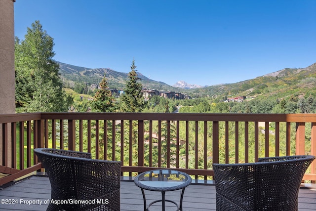 wooden terrace with a mountain view