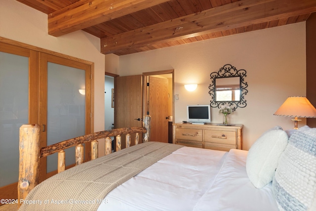 bedroom featuring beam ceiling and wooden ceiling