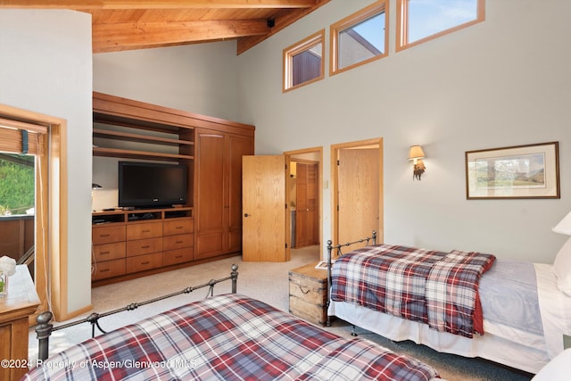 bedroom with beam ceiling, light colored carpet, wooden ceiling, and high vaulted ceiling