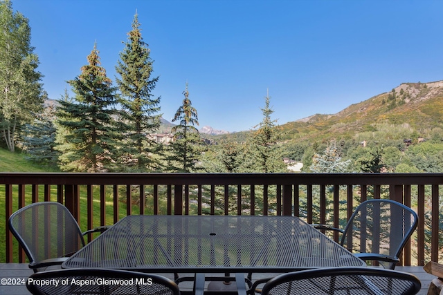 wooden terrace with a mountain view