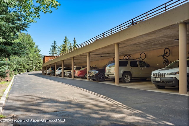 view of parking / parking lot with a carport