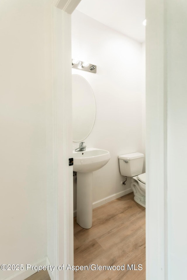 94 Castle Ridge Dr, New Castle, CO 81647 - bathroom with toilet and wood finished floors