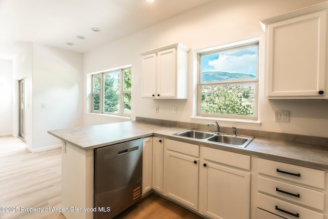 94 Castle Ridge Dr, New Castle, CO 81647 - kitchen with stainless steel dishwasher, a peninsula, light wood-style flooring, white cabinets, and recessed lighting