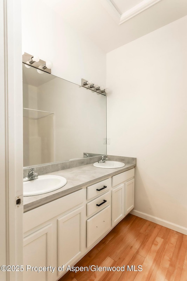 94 Castle Ridge Dr, New Castle, CO 81647 - full bathroom featuring double vanity, wood finished floors, and a shower