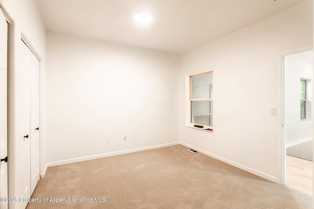 94 Castle Ridge Dr, New Castle, CO 81647 - unfurnished bedroom featuring light carpet and a closet