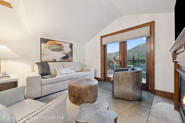 living room with french doors and lofted ceiling