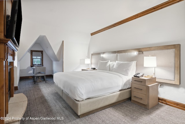 bedroom featuring crown molding and lofted ceiling