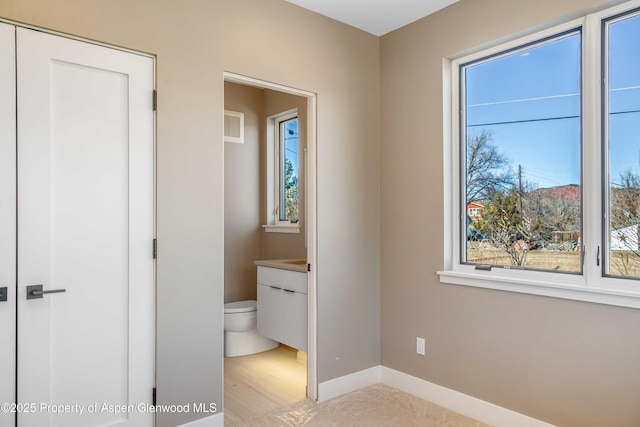 unfurnished bedroom with baseboards