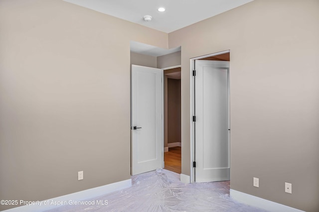 unfurnished bedroom featuring baseboards