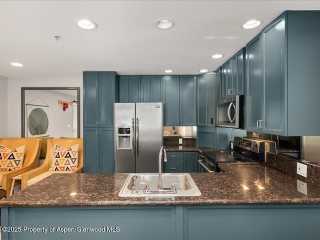326 Midland Ave Unit 302, Aspen, CO 81611 - kitchen featuring stainless steel appliances, recessed lighting, dark stone counters, and a peninsula
