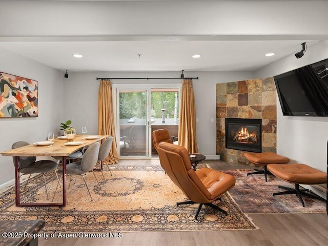 326 Midland Ave Unit 302, Aspen, CO 81611 - dining area featuring wood finished floors, a fireplace, and recessed lighting