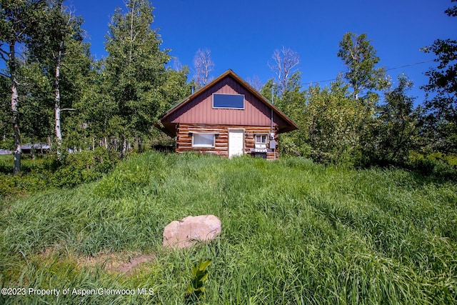 view of side of home with an outbuilding