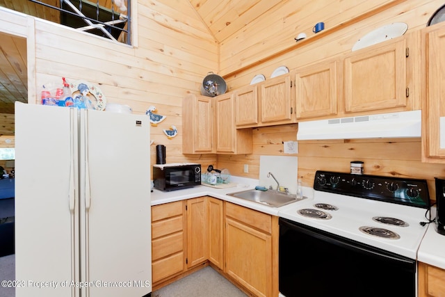 kitchen with sink, light brown cabinets, wood walls, vaulted ceiling, and white appliances