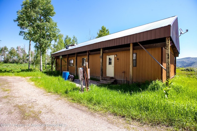 view of horse barn featuring a mountain view