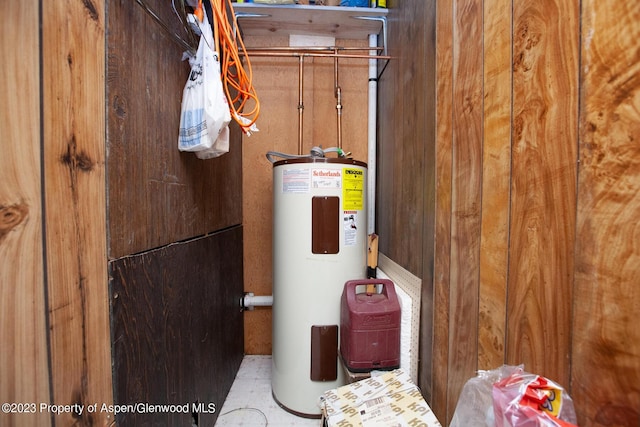 utility room featuring electric water heater