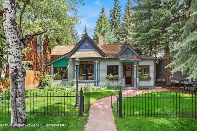 126 W Francis St, Aspen, CO 81611 - victorian house featuring a chimney and a gate