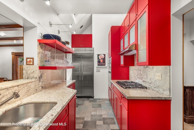 126 W Francis St, Aspen, CO 81611 - kitchen with stainless steel appliances, red cabinets, a sink, and open shelves