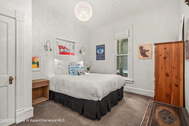 126 W Francis St, Aspen, CO 81611 - bedroom featuring carpet, baseboards, and a chandelier