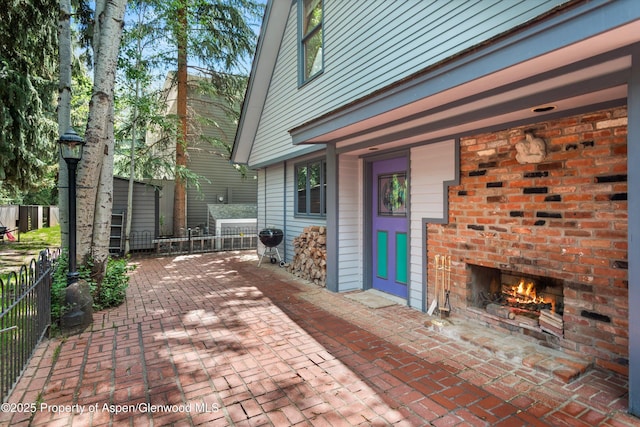 126 W Francis St, Aspen, CO 81611 - view of patio with an outdoor brick fireplace and a grill