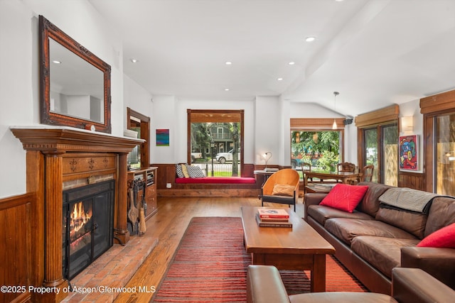 126 W Francis St, Aspen, CO 81611 - living room with wainscoting, a lit fireplace, vaulted ceiling, light wood-style floors, and recessed lighting