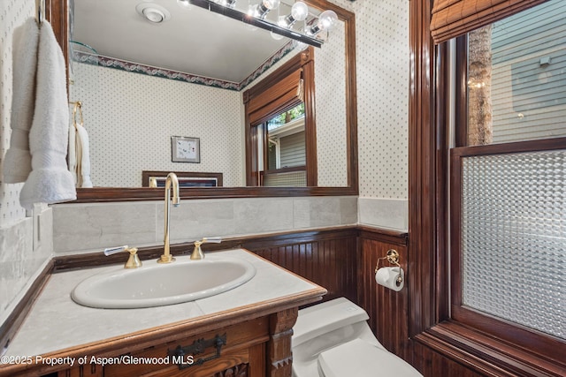 126 W Francis St, Aspen, CO 81611 - bathroom featuring wallpapered walls, toilet, and vanity