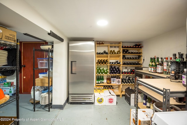 wine cellar featuring concrete flooring