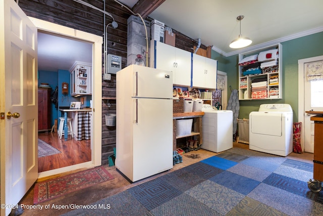 laundry room featuring washing machine and dryer and ornamental molding