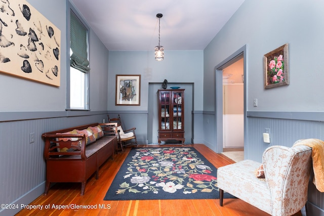 living area with hardwood / wood-style floors