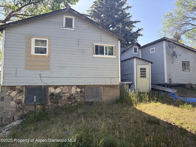 245 County Road 338, Parachute, CO 81635 - view of side of property featuring a shed