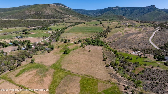 245 County Road 338, Parachute, CO 81635 - aerial overview of property's location featuring a mountainous background and rural landscape