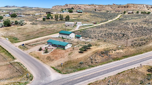 25 W 20th St, Craig, CO 81625 - aerial view of sparsely populated area with a mountain backdrop