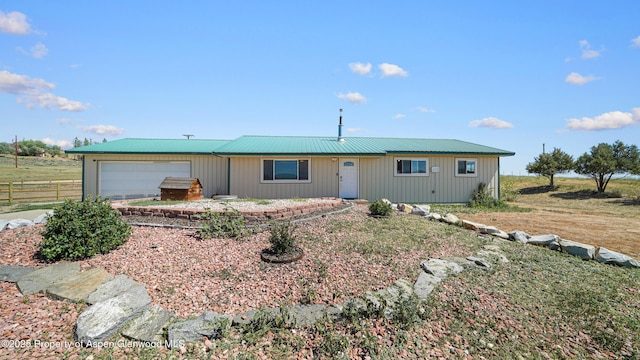 25 W 20th St, Craig, CO 81625 - ranch-style home featuring an attached garage and a metal roof