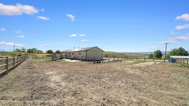25 W 20th St, Craig, CO 81625 - view of yard with a rural view, an enclosed horse arena, and an outdoor structure