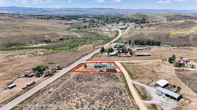 25 W 20th St, Craig, CO 81625 - aerial view of property and surrounding area featuring property boundaries highlighted and a mountain backdrop