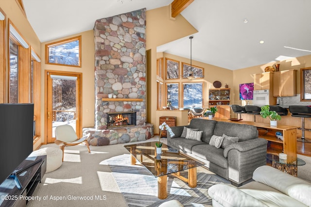 living room with a stone fireplace, high vaulted ceiling, beamed ceiling, and carpet flooring