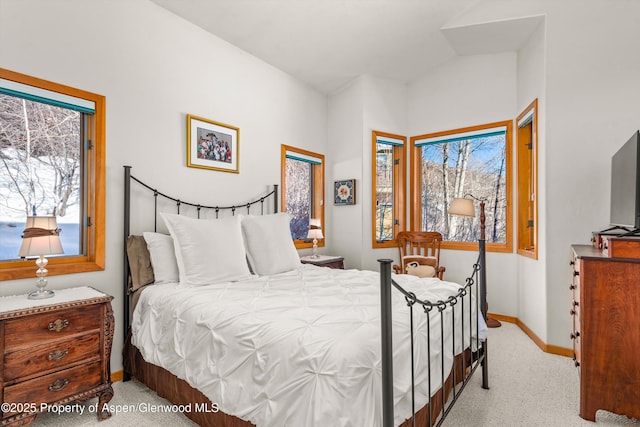 bedroom featuring light carpet