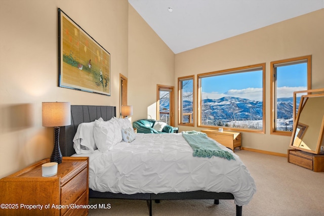 carpeted bedroom featuring lofted ceiling and multiple windows