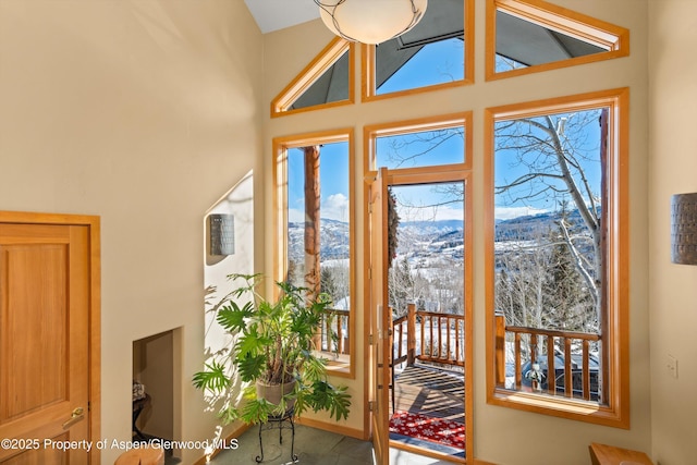 doorway with a mountain view and a healthy amount of sunlight