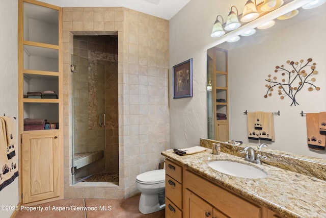 117 Deer Ln, Marble, CO 81623 - full bathroom featuring vanity, a stall shower, tile patterned floors, and built in shelves