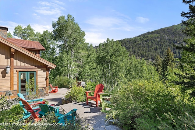 117 Deer Ln, Marble, CO 81623 - view of patio / terrace featuring a view of trees and a mountain view