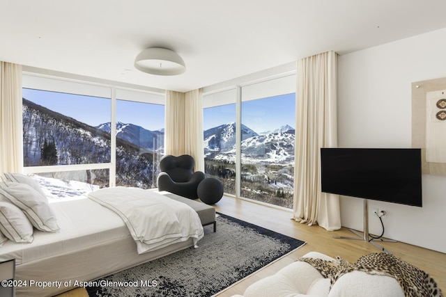 542 Carroll Dr, Aspen, CO 81611 - bedroom featuring wood finished floors and a wall of windows