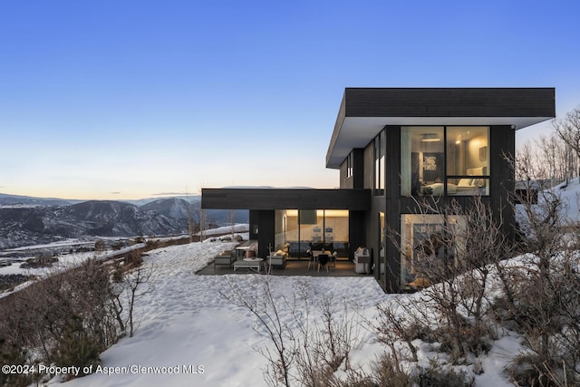 542 Carroll Dr, Aspen, CO 81611 - snow covered property with a mountain view and outdoor lounge area